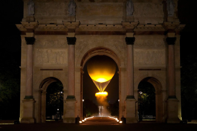 the-cauldron-rises-by-the-arc-de-triomphe-du-carrousel-in-paris-france-during-the-opening-ceremony-of-the-2024-summer-olympics-friday-july-26-2024-ap-photovadim-ghirda