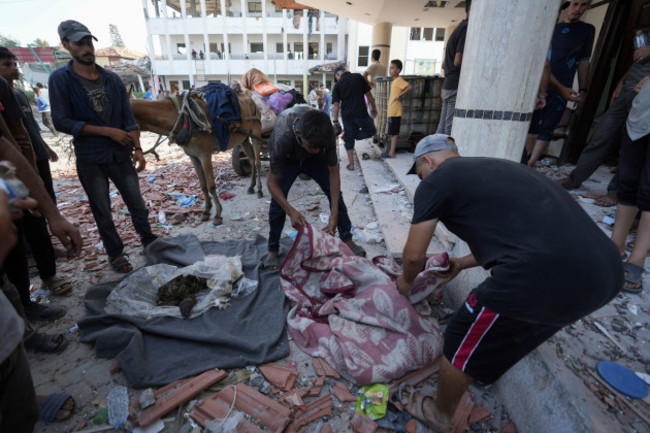 palestinians-search-for-bodies-in-the-rubble-of-a-school-destroyed-in-an-israeli-airstrike-on-deir-al-balah-central-gaza-strip-saturday-july-27-2024-ap-photoabdel-kareem-hana