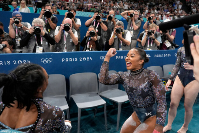 simone-biles-left-and-jordan-chiles-right-of-united-states-celebrate-after-competing-on-the-uneven-bars-during-a-womens-artistic-gymnastics-qualification-round-at-bercy-arena-at-the-2024-summer