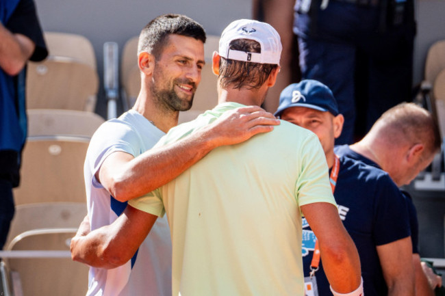 paris-france-25th-may-2024-spains-rafael-nadal-and-serbias-novak-djokovic-hughold-each-other-during-a-practice-session-during-the-french-open-tennis-tournament-on-court-philippe-chatrier-at-the