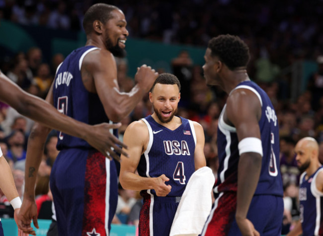 lille-france-july-28-stephen-curry-of-united-states-celebrates-with-kevin-durant-of-united-statesand-anthony-edwards-of-united-states-during-the-mens-basketball-group-phase-group-c-game-between