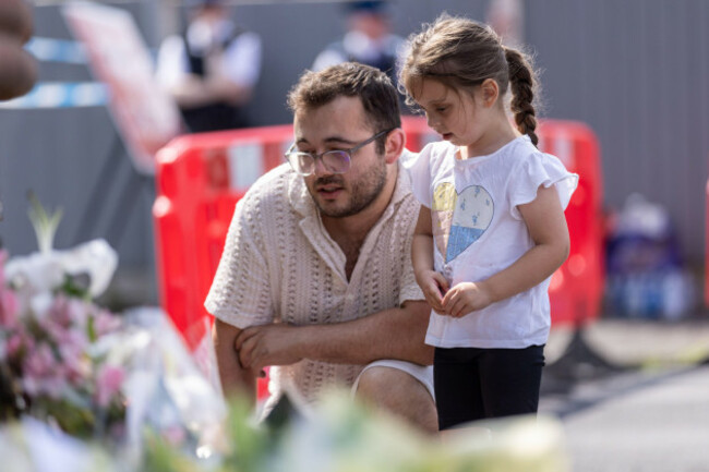 people-lay-flowers-near-the-scene-in-hart-street-southport-where-three-children-died-and-eight-were-injured-in-a-ferocious-knife-attack-during-a-taylor-swift-event-at-a-dance-school-on-monday-a-1