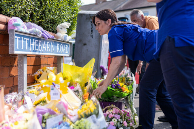 people-lay-flowers-near-the-scene-in-hart-street-southport-where-three-children-died-and-eight-were-injured-in-a-ferocious-knife-attack-during-a-taylor-swift-event-at-a-dance-school-on-monday-a-1