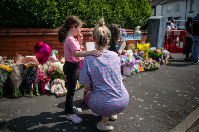 people-lay-flowers-near-the-scene-in-hart-street-southport-where-three-children-died-and-eight-were-injured-in-a-ferocious-knife-attack-during-a-taylor-swift-event-at-a-dance-school-on-monday-a-1