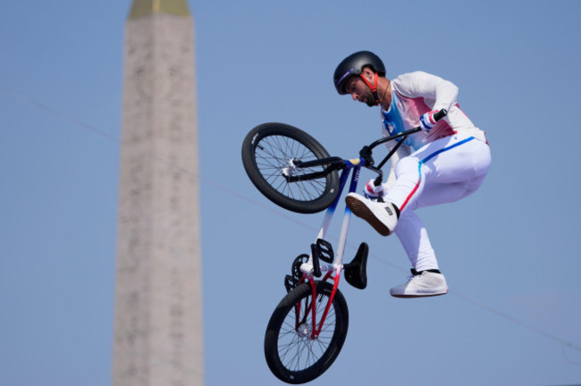 anthony-jeanjean-of-france-performs-a-trick-with-the-luxor-obelisk-of-la-concorde-square-in-the-background-during-the-cycling-bmx-freestyle-mens-park-qualification-at-the-2024-summer-olympics-tu