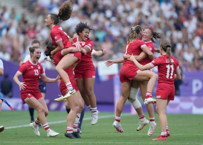 members-of-the-canadian-team-celebrate-after-winning-the-womens-semifinal-rugby-sevens-match-between-canada-and-australia-at-the-2024-summer-olympics-in-the-stade-de-france-in-saint-denis-france