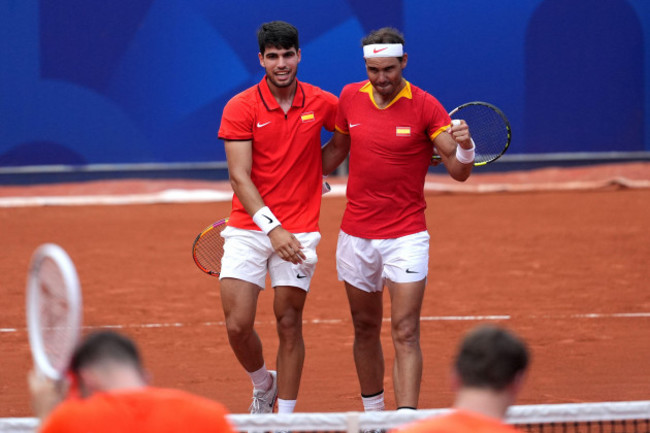 spains-carlos-alcaraz-and-rafael-nadal-right-celebrate-victory-over-netherlands-tallon-griekspoor-and-wesley-koolhof-not-pictured-during-the-mens-doubles-second-round-match-at-roland-garros-on