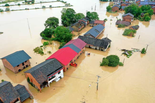 changsha-28th-july-2024-an-aerial-drone-photo-taken-on-july-28-2024-shows-rescuers-relocating-residents-at-jingtang-village-of-zixing-city-central-chinas-hunan-province-the-residual-winds-from