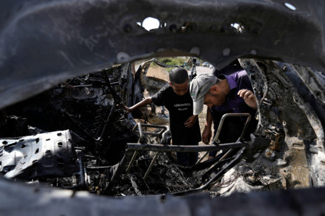 palestinians-inspect-a-car-destroyed-in-a-drone-strike-zeita-village-north-of-the-west-bank-city-of-tulkarem-saturday-aug-3-2024-the-israeli-military-says-it-struck-five-suspected-terrorists-in