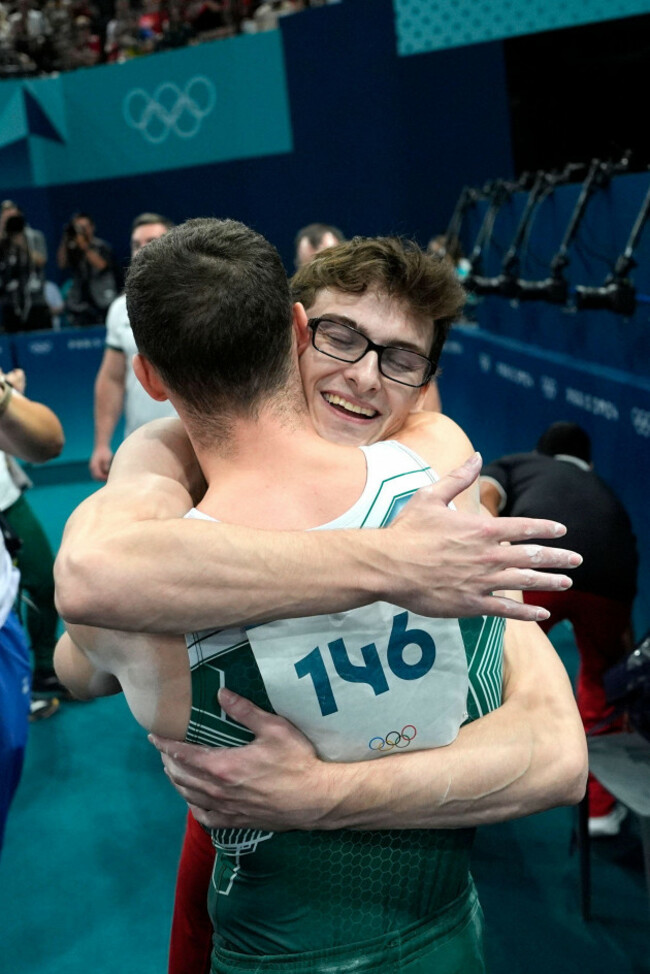 bronze-medalist-stephen-nedoroscik-of-the-united-states-hugs-gold-medalist-rhys-mcclenaghan-146-of-ireland-during-the-mens-artistic-gymnastics-individual-pommel-finals-at-bercy-arena-at-the-202