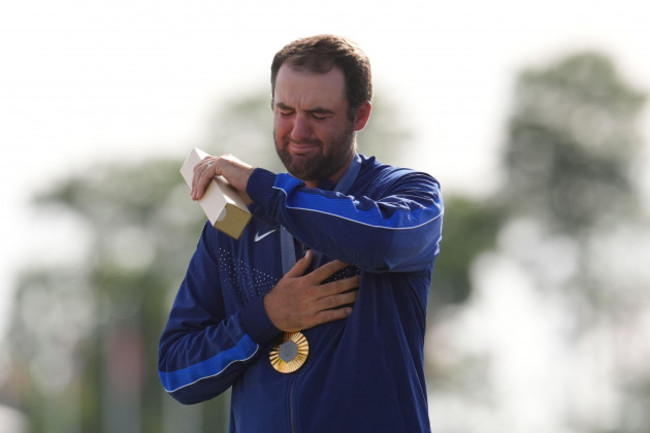 gold-medalist-scottie-scheffler-of-the-united-states-cries-as-the-national-anthem-of-the-us-is-played-during-the-medal-ceremony-for-mens-golf-at-the-2024-summer-olympics-sunday-aug-4-2024-at-l