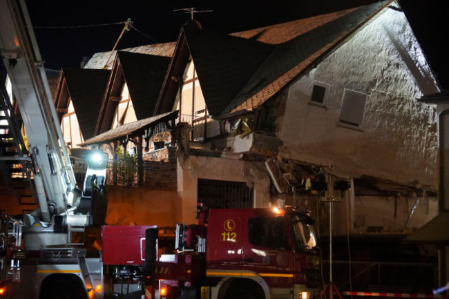 a-fire-department-vehicle-stands-in-front-of-a-collapsed-hotel-in-kroev-germany-wednesday-aug-7-2024-florian-blaesdpa-via-ap