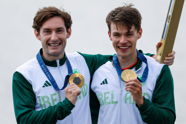 gold-medalists-fintan-mccarthy-and-paul-odonovan-of-ireland-celebrate-on-the-podium-after-lightweight-mens-double-sculls-final-a-of-the-rowing-on-vaires-sur-marne-nautical-stadium-flat-water-durin