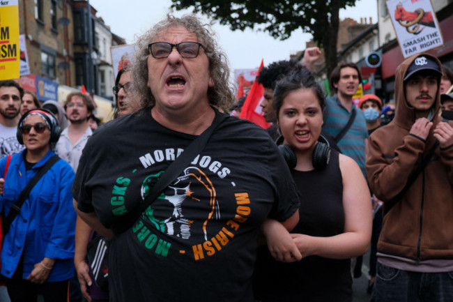 london-uk-7th-august-2024-a-man-and-a-woman-chant-slogans-thousands-of-anti-racists-attended-a-rally-in-walthamstow-organised-as-a-counter-demonstration-by-stand-up-to-racism-sutr-ahead-of-a