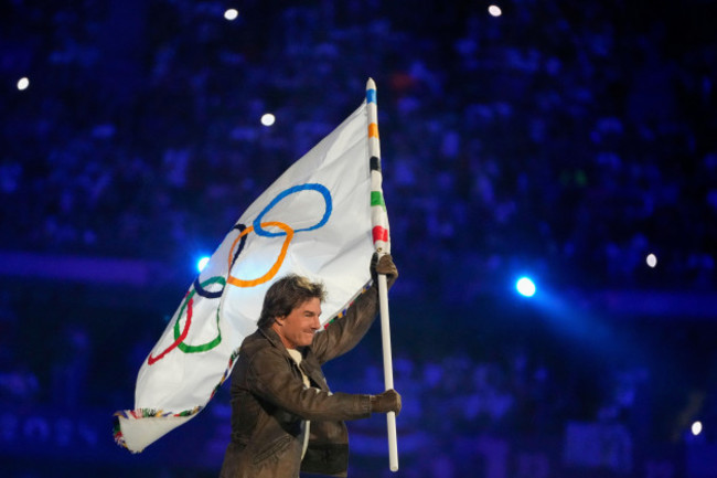 tom-cruise-carries-the-olympic-flag-during-the-2024-summer-olympics-closing-ceremony-at-the-stade-de-france-sunday-aug-11-2024-in-saint-denis-france-ap-photonatacha-pisarenko