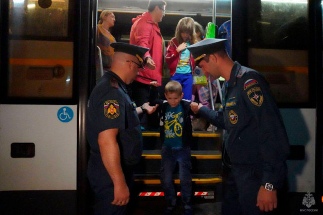 in-this-photo-released-by-russian-emergency-situations-ministry-press-service-people-evacuated-from-a-fighting-between-russian-and-ukrainian-forces-in-kursk-region-arrive-to-a-temporary-residence-cen