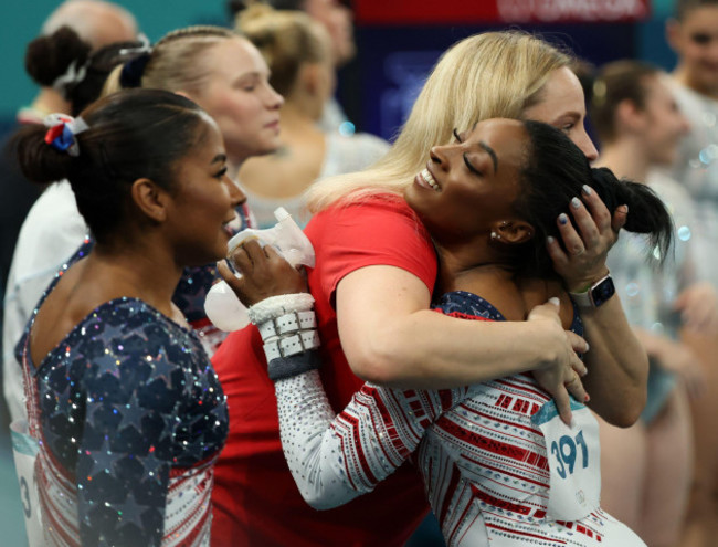 paris-ile-de-france-france-30th-july-2024-simone-biles-of-the-united-states-hugs-coach-cecile-canqueteau-landi-after-competing-on-the-uneven-bars-during-the-womens-team-final-artistic-gymnastics