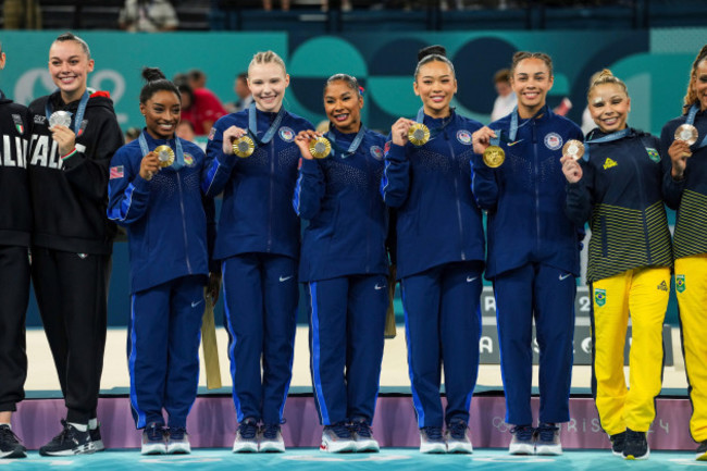 simone-biles-of-united-states-jade-carey-of-united-states-jordan-chiles-of-united-states-sunisa-lee-of-united-states-and-healy-rivera-of-united-states-celebrate-on-the-podium-for-winning-the-gold-m