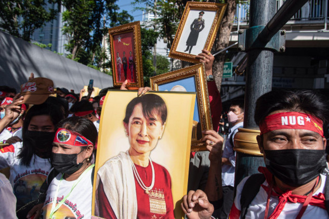 a-protester-holds-a-portrait-of-aung-san-suu-kyi-during-the-demonstration-burmese-protesters-gathered-outside-the-myanmar-embassy-in-bangkok-to-mark-international-migrants-day-and-protest-against-the