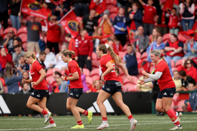 alana-mcinerney-celebrates-scoring-a-try-with-teammates