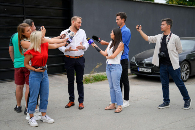 internet-influencer-andrew-tates-lawyer-eugen-vidineac-talks-to-media-during-an-early-morning-search-raid-by-the-police-on-the-outskirts-of-bucharest-romania-wednesday-aug-21-2024-ap-photo-v