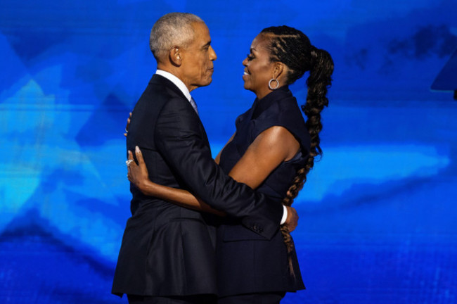 former-president-barack-obama-and-former-first-lady-michelle-obama-embrace-during-the-second-night-of-the-democratic-national-convention-at-the-united-center-in-chicago-on-aug-20-2024-francis-chun