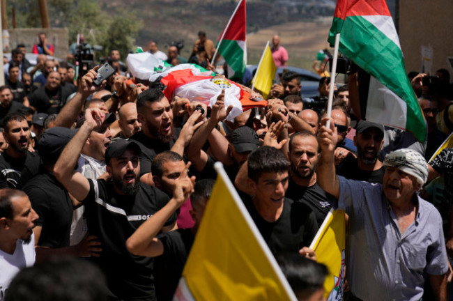 mourners-carry-the-body-of-palestinian-rasheed-mahmoud-sadah-23-who-was-killed-during-a-rampage-by-israeli-settlers-during-his-funeral-in-the-west-bank-village-of-jit-near-nablus-friday-aug-16