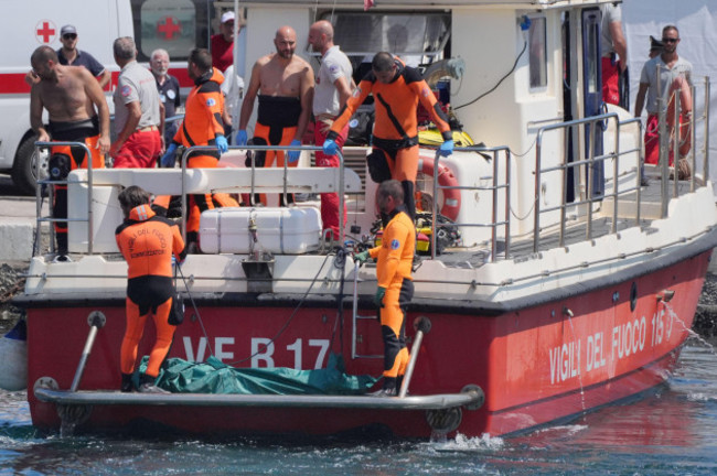 a-body-bag-is-brought-ashore-at-the-harbour-in-porticello-by-rescue-workers-on-the-fifth-day-of-the-search-and-recovery-operation-after-the-luxury-yacht-bayesian-sank-in-a-storm-on-monday-whilst-moor