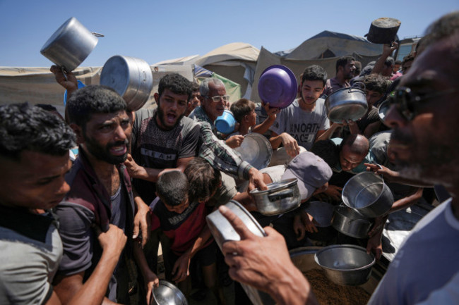 displaced-palestinians-gather-at-a-food-distribution-center-in-deir-al-balah-central-gaza-strip-friday-aug-23-2024-ap-photoabdel-kareem-hana