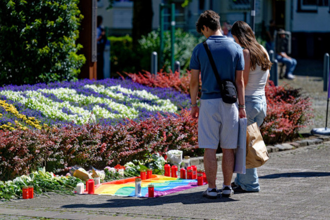 people-lay-flowers-near-the-scene-of-a-knife-attack-in-solingen-city-center-germany-saturday-aug-24-2024-after-three-people-were-killed-and-at-least-eight-people-were-wounded-friday-night-at-the