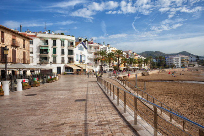 sitges-resort-coastal-town-in-spain-promenade-along-platja-sant-sebastia-beach