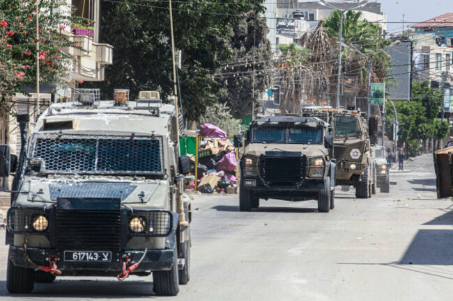 jenin-west-bank-palestine-31st-aug-2024-israeli-armoured-vehicles-drive-in-a-street-during-an-army-raid-in-jenin-the-israeli-army-said-two-palestinians-were-killed-overnight-while-preparing-to-c