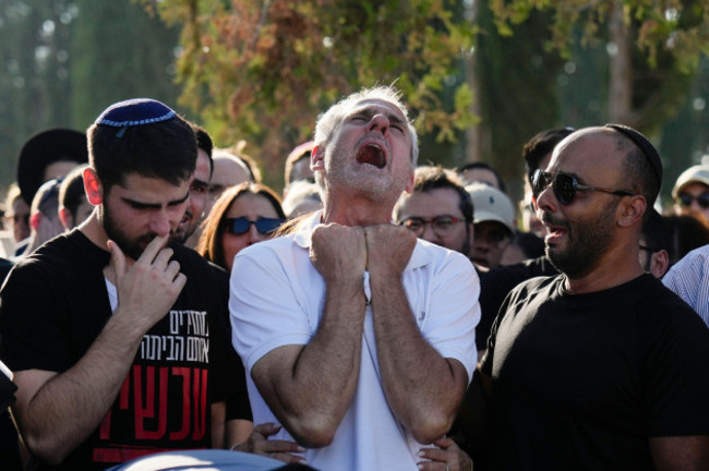 yigal-sarusi-center-mourns-during-the-funeral-of-his-son-slain-hostage-almog-sarusi-who-was-killed-in-hamas-captivity-in-the-gaza-strip-at-a-cemetery-in-raanana-israel-sunday-sept-1-2024