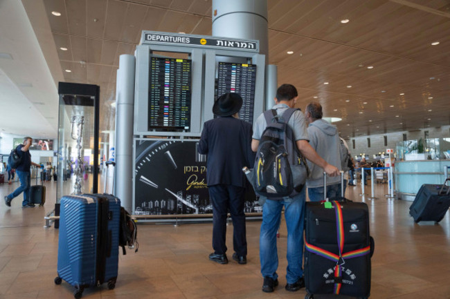 travelers-check-departing-flights-at-ben-gurion-international-airport-near-tel-aviv-israel-monday-sept-2-2024-outgoing-flights-at-the-airport-were-halted-for-two-hours-on-monday-morning-as-part-o