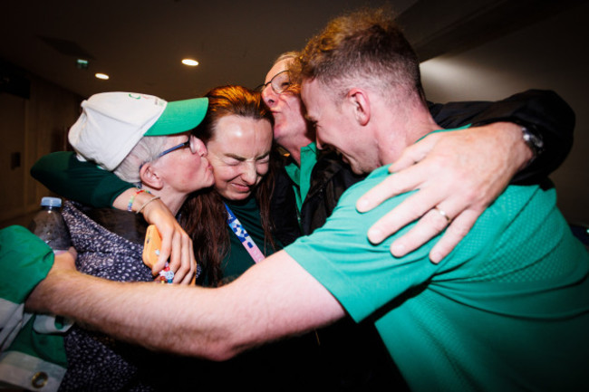 ellen-keane-is-hugged-by-her-parents-laura-and-eddie-and-brother-graham-after-competing-in-her-last-race