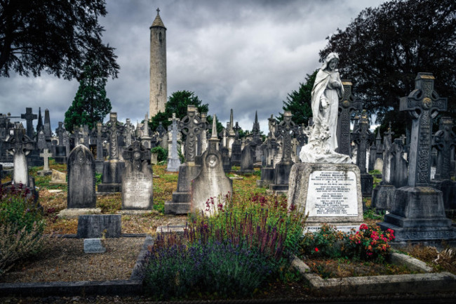 ancient-graves-and-tombstones-in-glasnevin-cemetery-with-round-tower-ireland