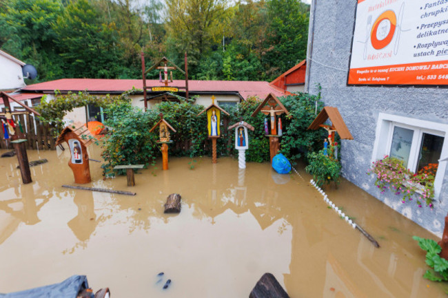 a-flooded-backyard-with-carved-wood-religious-figures-in-klodzko-southwest-poland-as-days-of-unusually-heavy-rain-have-swollen-rivers-and-spilled-over-embankments-in-the-region-on-sunday-sept-15