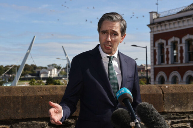 taoiseach-simon-harris-speaking-to-the-media-on-the-derry-walls-during-his-first-official-visit-to-londonderry-as-taoiseach-for-a-series-of-meetings-with-political-civic-society-and-community-leader