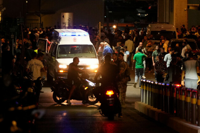 people-gather-around-an-ambulance-carrying-wounded-people-whose-handheld-pager-exploded-at-the-emergency-entrance-of-the-american-university-hospital-in-beirut-lebanon-tuesday-sept-17-2024-ap