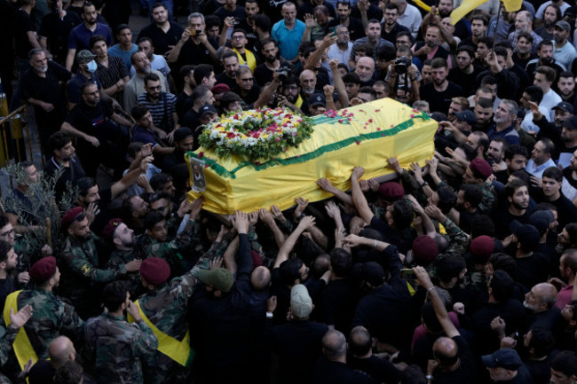 corrects-day-to-tuesday-when-killed-hezbollah-fighters-carry-one-of-the-coffins-of-four-fallen-comrades-who-were-killed-tuesday-after-their-handheld-pagers-exploded-during-their-funeral-procession-in