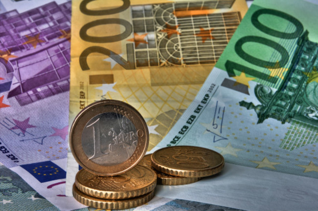 money-euros-eur-with-coins-infront