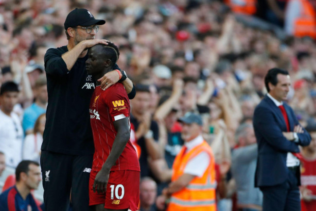 liverpools-manager-jurgen-klopp-left-hugs-liverpools-sadio-mane-during-the-english-premier-league-soccer-match-between-liverpool-and-arsenal-at-anfield-stadium-in-liverpool-england-saturday-aug