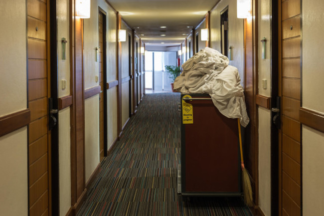 maids-cart-with-a-towel-in-hotel-corridor