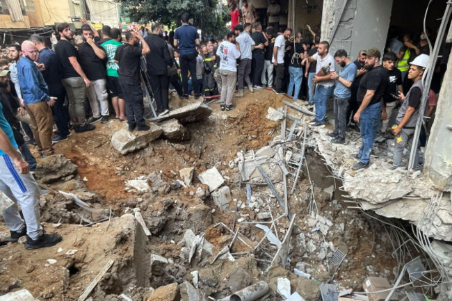 people-gather-at-the-scene-of-an-israeli-missile-strike-in-the-southern-suburbs-of-beirut-friday-sept-20-2024-ap-photobilal-hussein