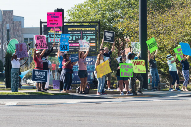 suwanee-ga-usa-september-7-2024-democratic-party-volunteers-encourage-passing-vehicles-to-blow-their-horns-at-a-local-honk-for-harris-event