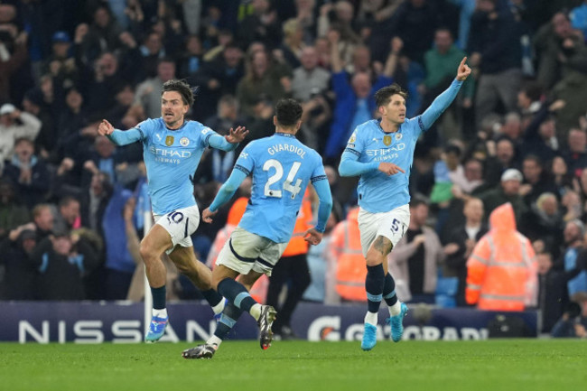 manchester-citys-john-stones-right-celebrates-scoring-their-sides-second-goal-of-the-game-during-the-premier-league-match-at-the-etihad-stadium-manchester-picture-date-sunday-september-22-2024