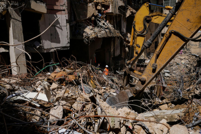 rescuers-sift-through-the-rubble-as-they-search-for-people-still-missing-at-the-site-of-fridays-israeli-strike-in-beiruts-southern-suburbs-monday-sept-23-2024-ap-photohassan-ammar