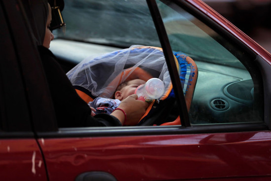 a-woman-feeds-her-newborn-in-a-car-in-sidon-lebanon-as-she-flees-the-southern-villages-amid-ongoing-israeli-airstrikes-monday-sept-23-2024-ap-photomohammed-zaatari