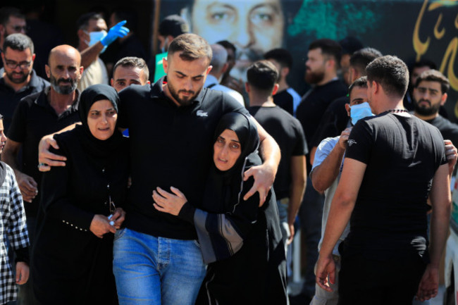 people-react-during-the-funeral-procession-of-their-relatives-who-were-killed-in-mondays-israeli-airstrikes-in-the-southern-village-of-saksakieh-lebanon-tuesday-sept-24-2024-ap-photomohamme