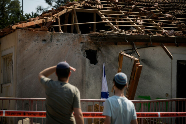 people-look-at-a-damaged-house-that-was-hit-by-a-rocket-fired-from-lebanon-near-safed-northern-israel-on-wednesday-sept-25-2024-ap-photoleo-correa